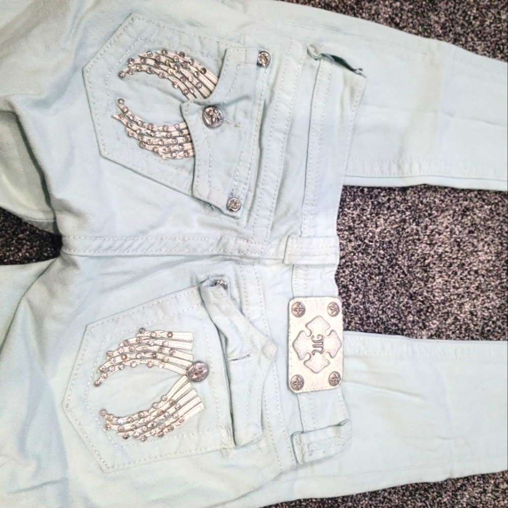 Mint green winged Miss Me skinny jeans size 25